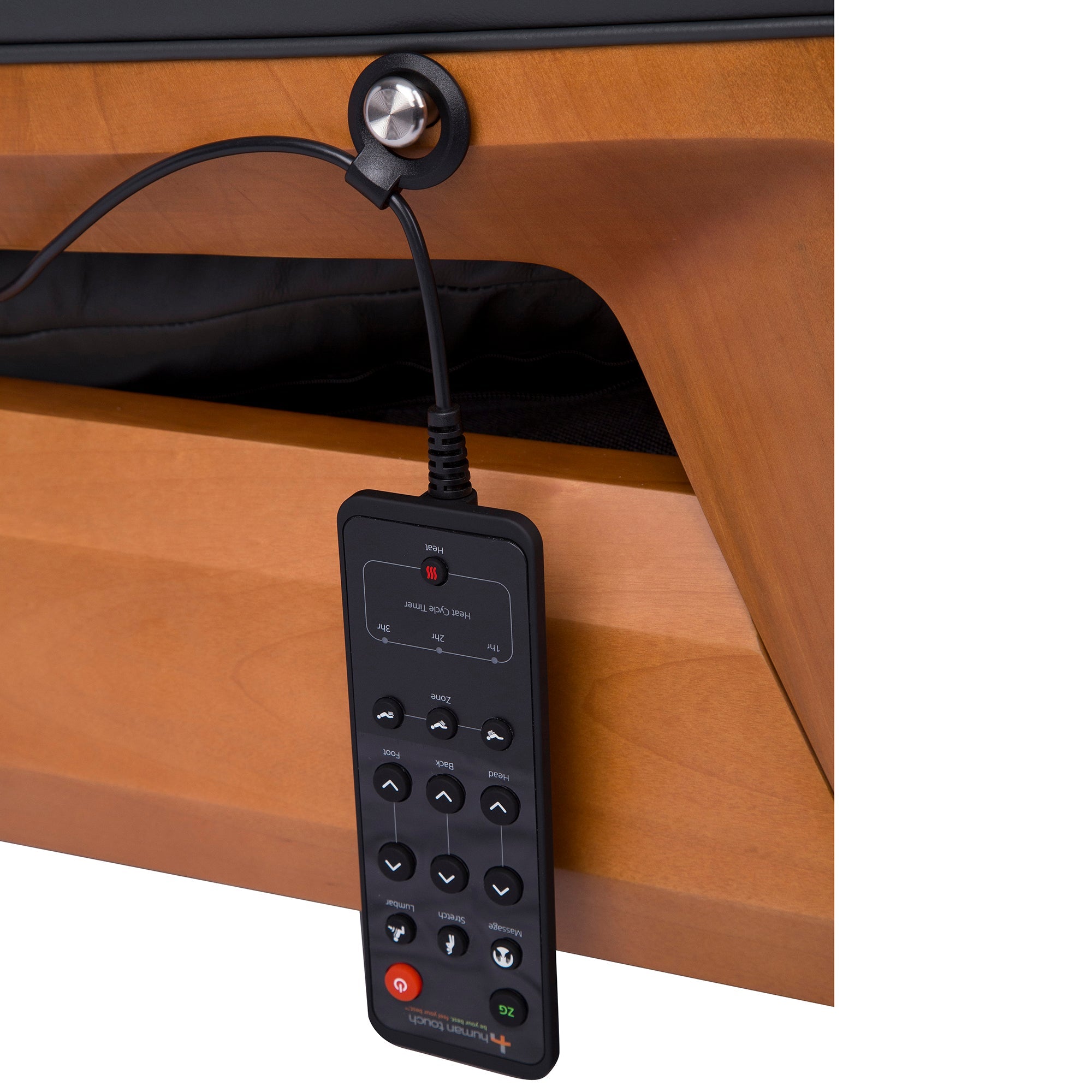 Gravis ZG Chair remote control panel with massage and position adjustment buttons on wooden armrest surface