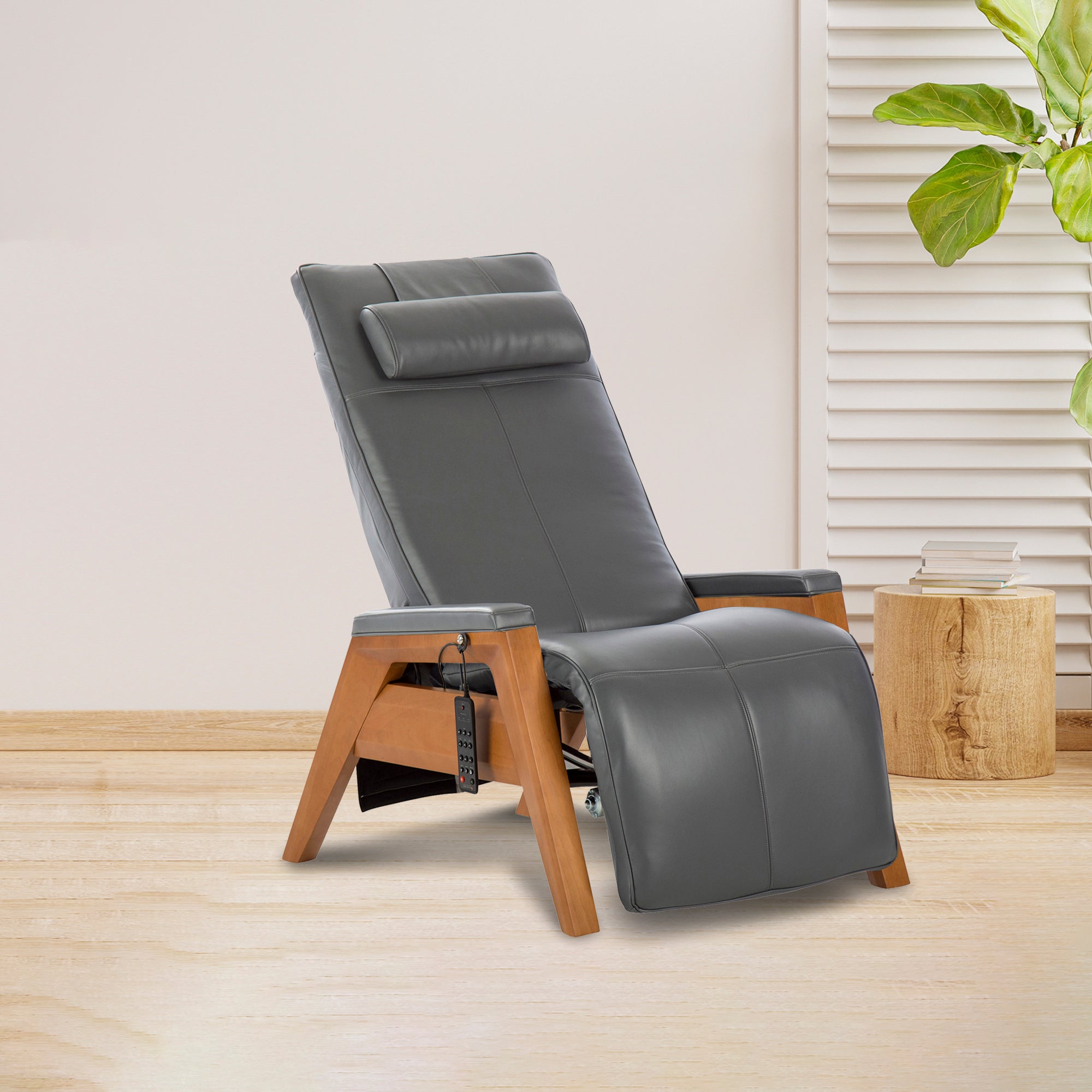 Gravis ZG Chair with gray leather upholstery and wooden base, displayed in modern minimalist setting with plant decor