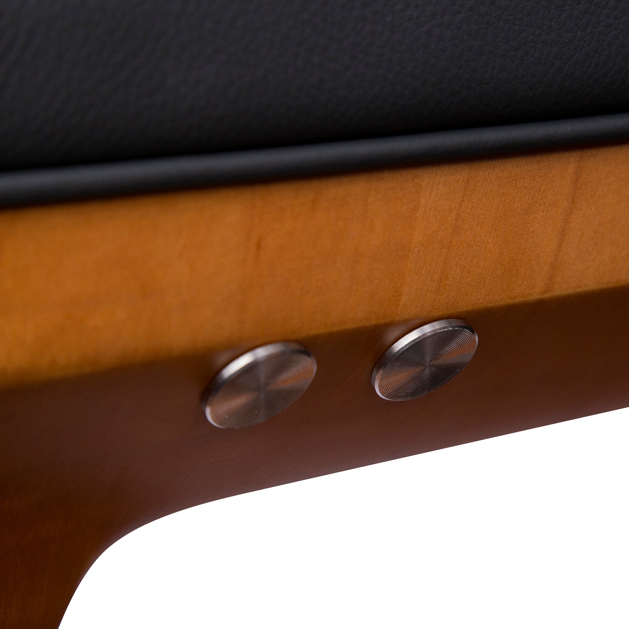 Gravis ZG Chair detail showing sleek metallic control buttons mounted on wooden armrest with black upholstery