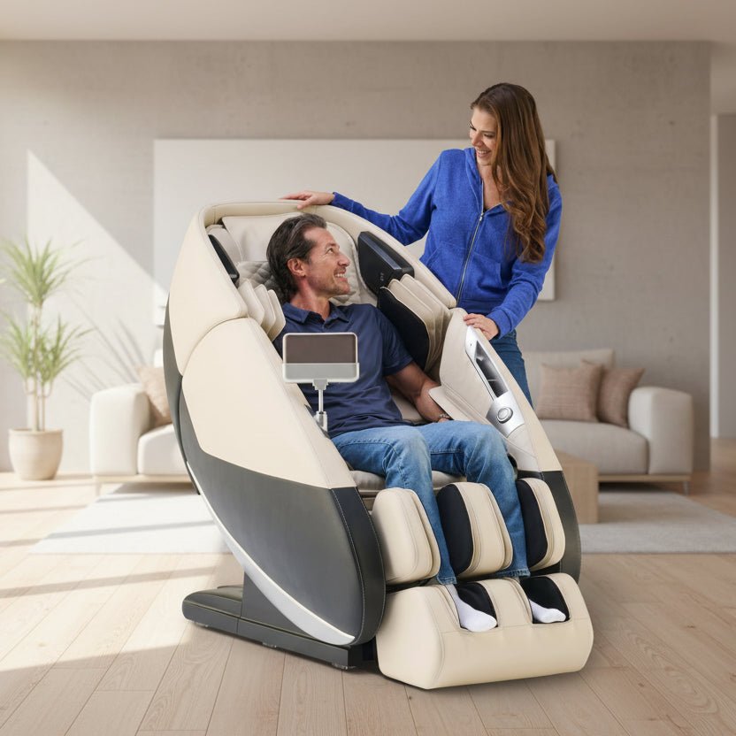 Man using a Super Novo 3.0 massage chair with a woman assisting him.