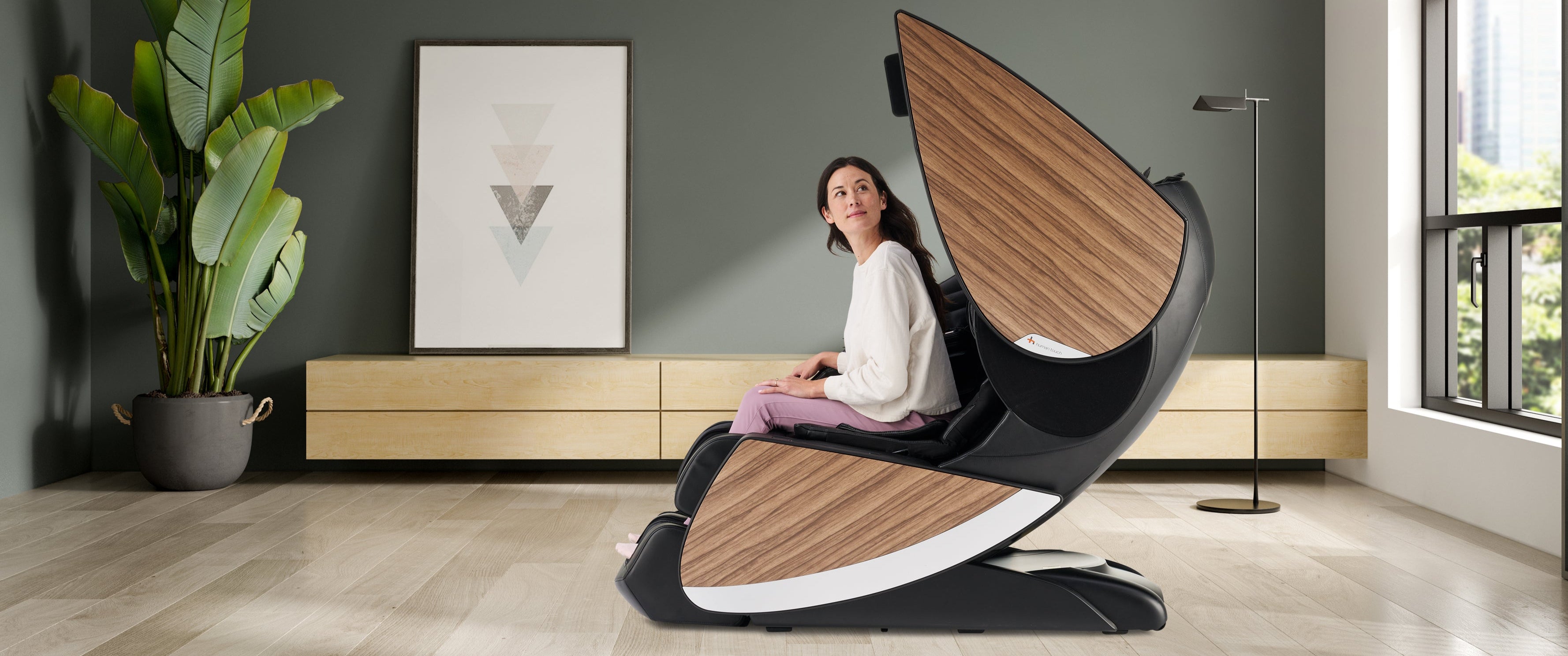 Woman in Super Novo X massage Chair by Human Touch with Doors Open