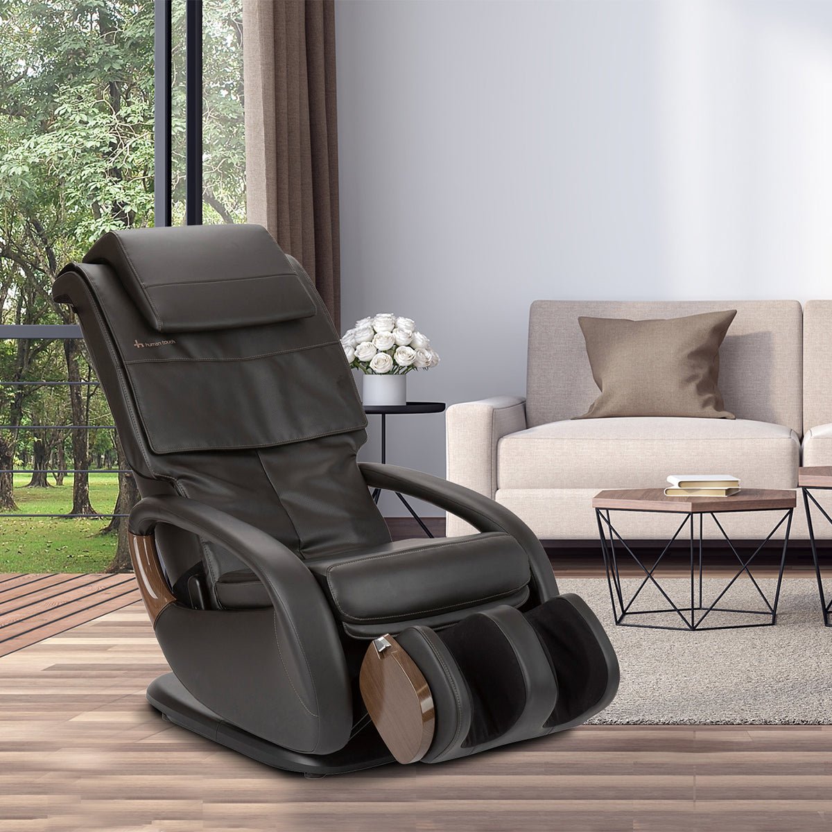 WholeBody 8.0 massage chair in black leather, positioned in modern living room with window view and natural light